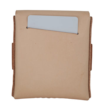 A tan leather card holder or wallet with a vertical slot containing a light gray card, shown against a plain white background. 