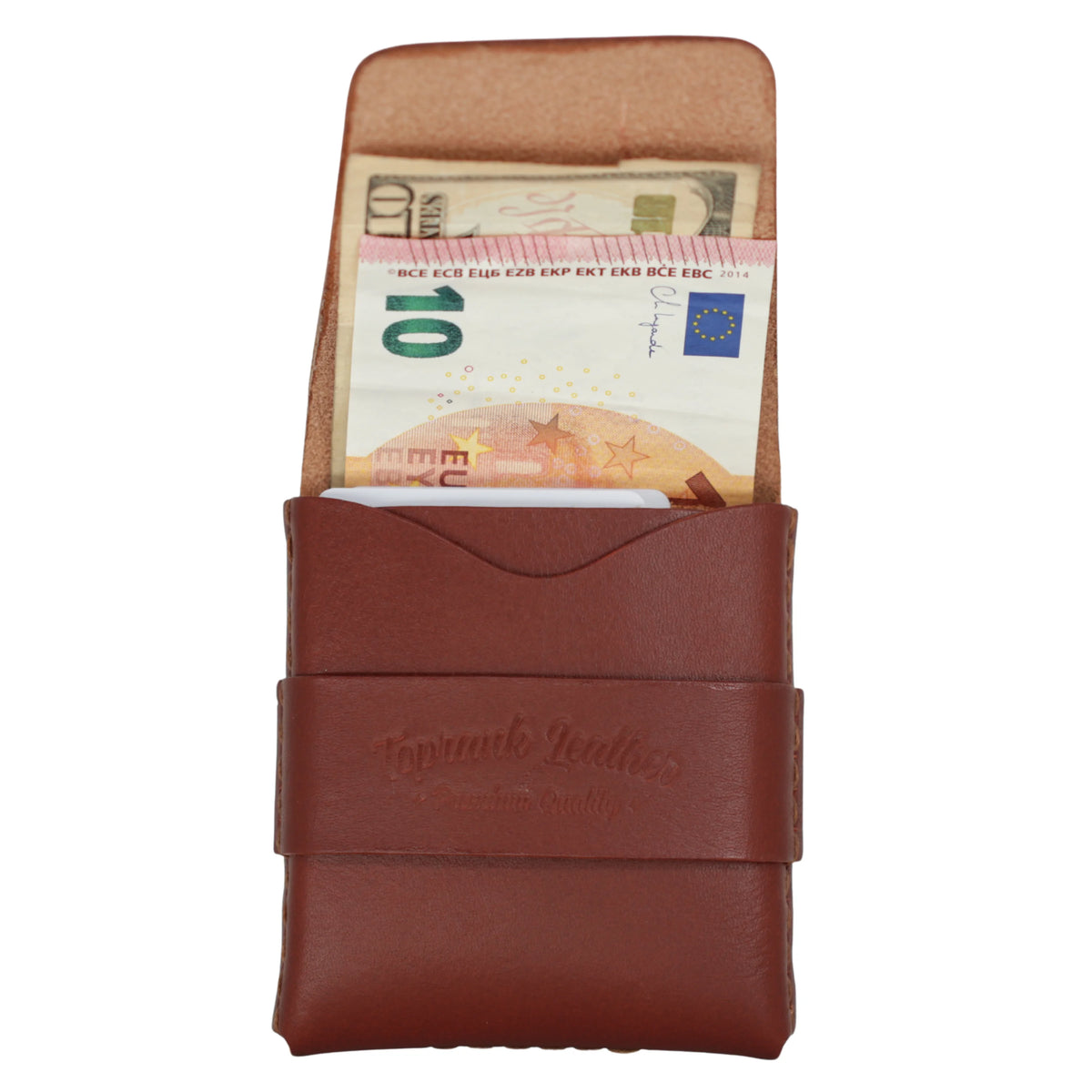A brown leather money clip wallet with a strap closure and embossed logo, shown open with euro banknotes tucked inside, on a plain white background. 