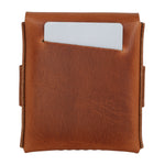 A brown leather card holder wallet with a white card partially inserted into a front slip pocket, shown against a plain white background. 