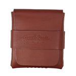 A brown leather card holder wallet with a strap closure embossed with 'Topants Leather' on a plain white background. 