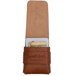 A brown leather card holder wallet with a strap closure, featuring an embossed 'Topra's Leather' logo. The wallet is shown open, displaying a tan interior and holding cards and cash inside, set against a plain white background. 