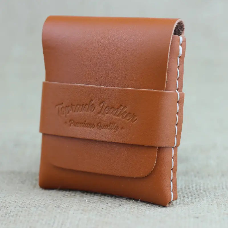 Brown leather card holder wallet with strap, perfect for stylish organization