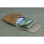 Tan leather card wallet with cash in a Compact Handcrafted Leather Card Holder Wallet