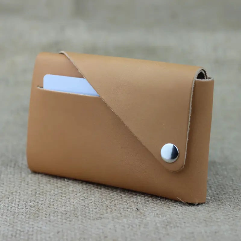 Tan leather card wallet shown in Trisnap Fold stitchless minimalist leather wallet